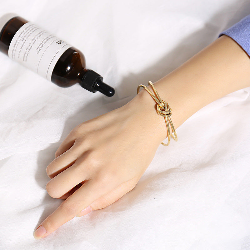Bracelet Nœud — jonc doré — photographie fournisseur, vue 1