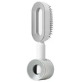 Brosse autonettoyante D’un Geste blanche, modèle à poussoir